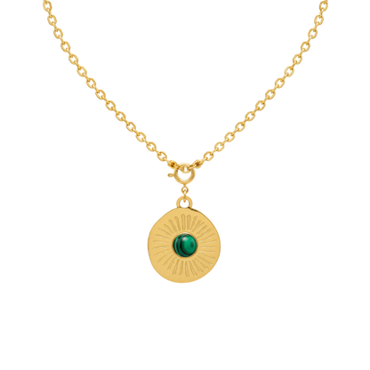 Gold necklace with a green gemstone pendant on a white background